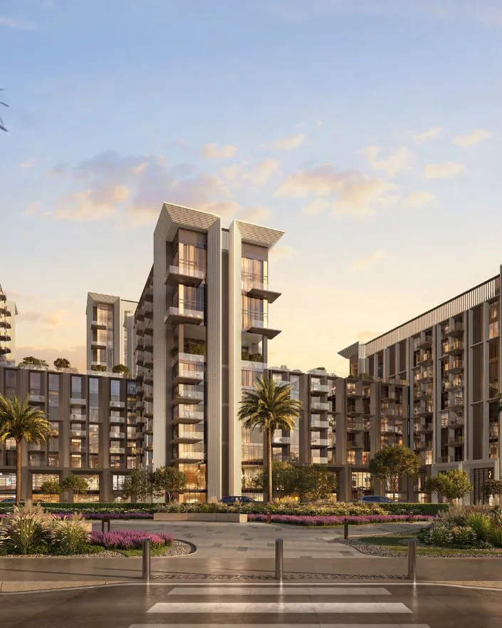 Sei Saadiyat towers with balconies and planted frontage under a soft evening sky