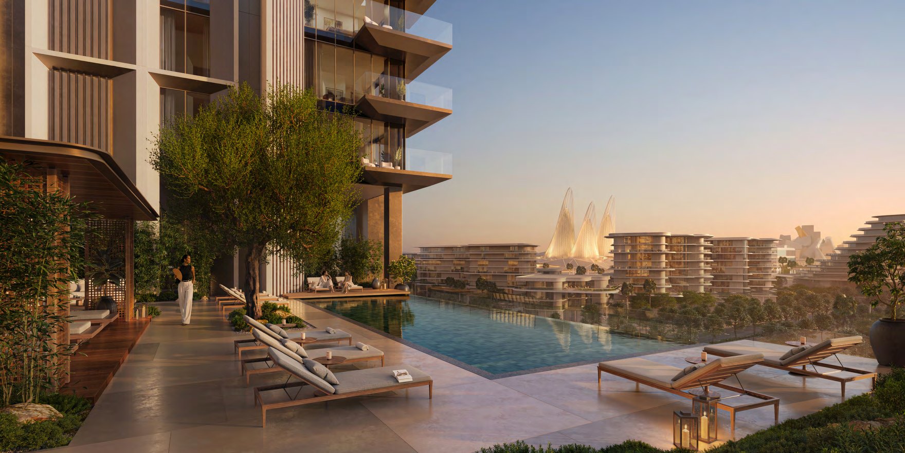 Rooftop infinity pool with loungers, looking out over Saadiyat Cultural District at sunset